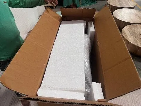 Opened export carton showing corner and edge protection