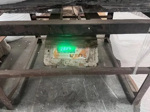Export carton weighed on a scale during a pre-shipment inspection