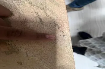 Minor defect: grinding marks on a solid wood dining table top