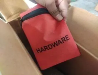 Hardware bag checked inside a furniture carton