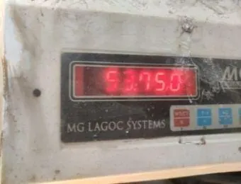 Carton weight checked on a digital scale: 53.75 kg