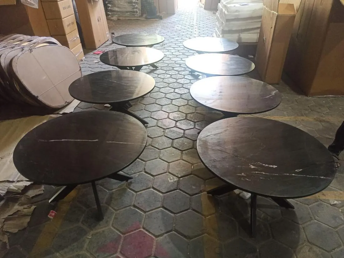 Round black marble tables laid out for inspection in Jodhpur
